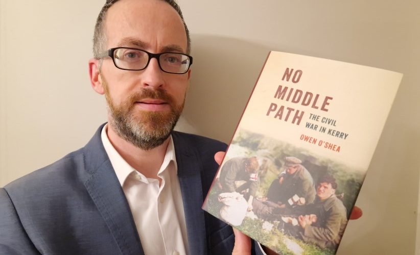 Owen O'Shea pictured holding his book