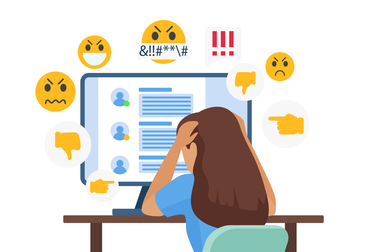 Cyber bullying illustration: cartoon depicting distressed bullied girl character sitting in front of computer with negative online icons from social media.