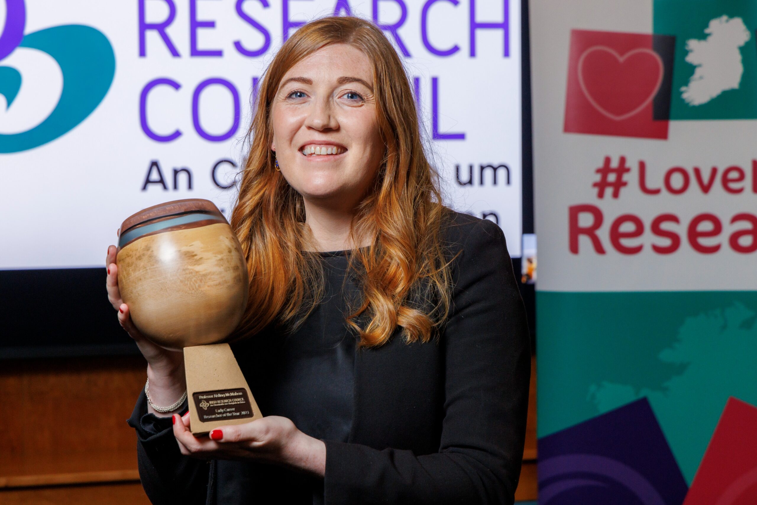 Professor Aisling McMahon pictured holding a trophy