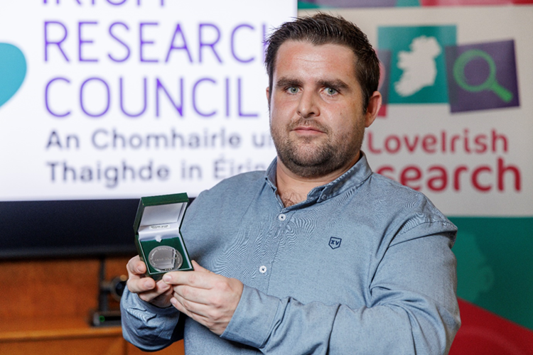 Aaron Maloney pictured holding a medal