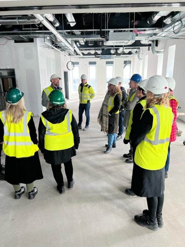 Staff from the AHRC and the IRC pictured visiting the construction site for Studio Ulster, a large-scale virtual production campus at Belfast Harbour Studios. Researchers from the University of Ulster were key in developing the funding bid for the AHRC-funded CoSTAR programme