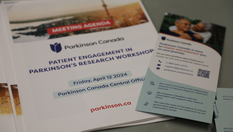 Image of brochure's for a conference. on Parkinson's Research workshop
